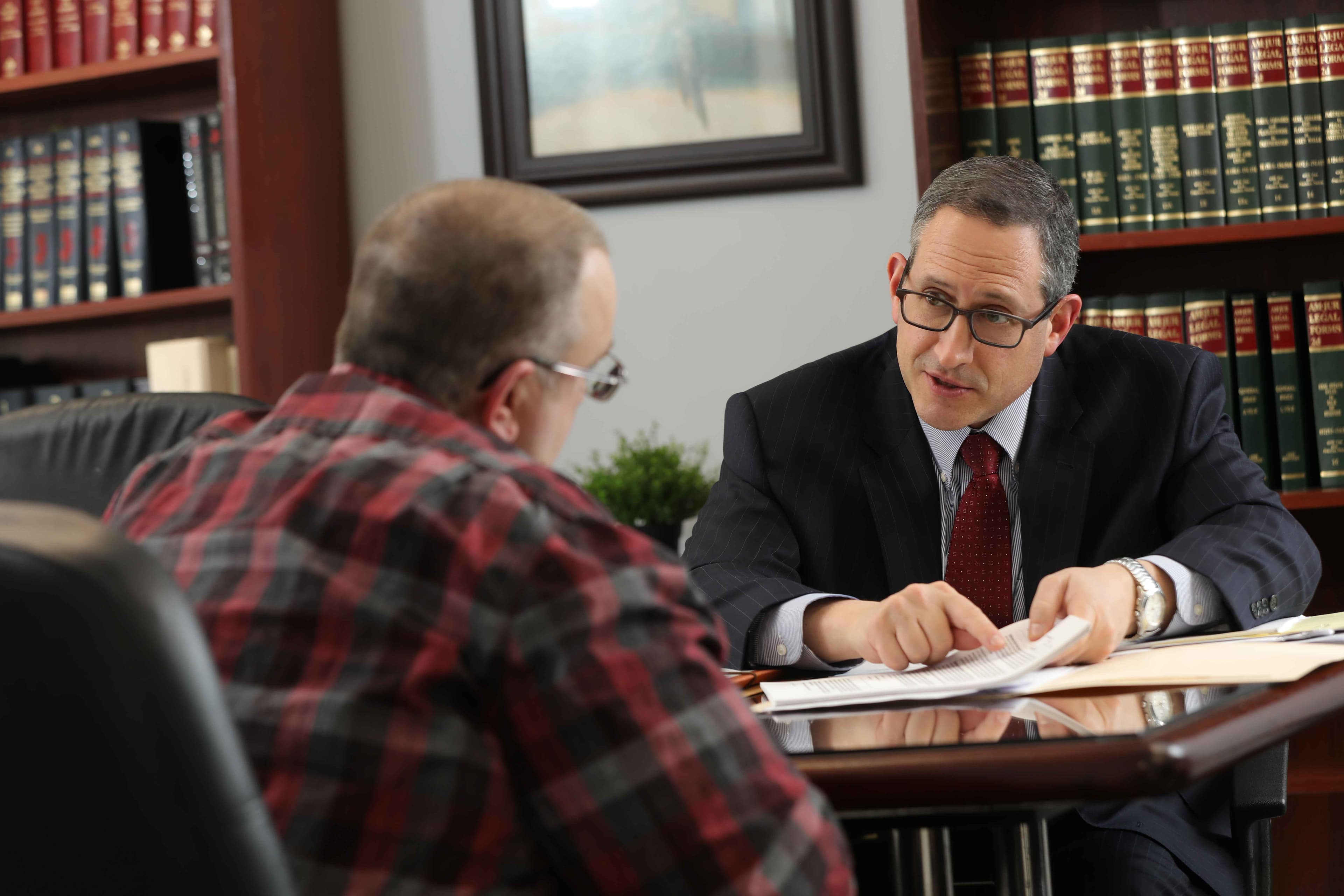 Lawyer preparing a denied SSDI appeal for a New Jersey claimant