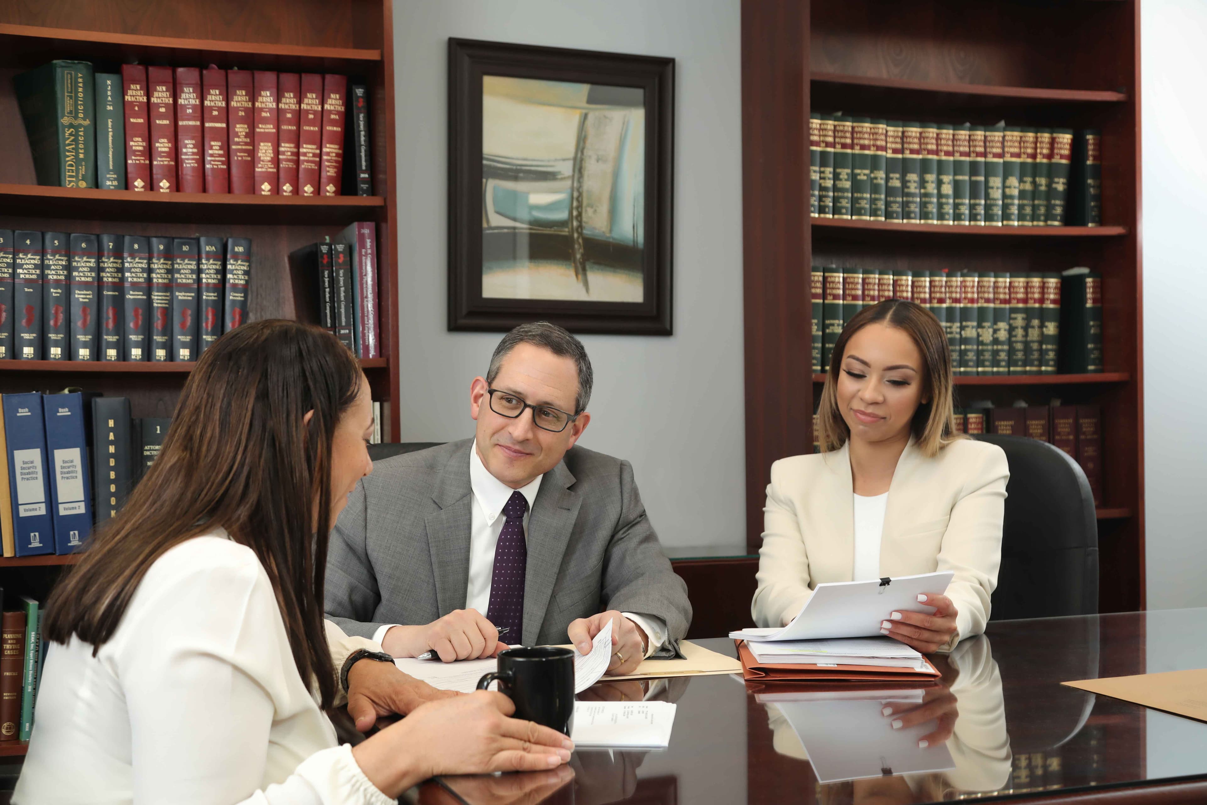 Family meeting with a New Jersey workers compensation attorney about dependency benefits